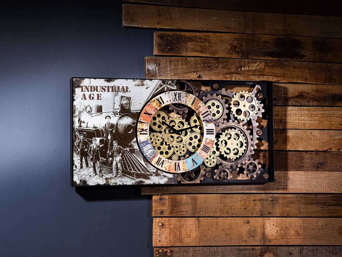 Vintage trifft auf Industrie: Die Gilde Metall Wanduhr mit beweglichen Zahnrädern und Zugabbildung