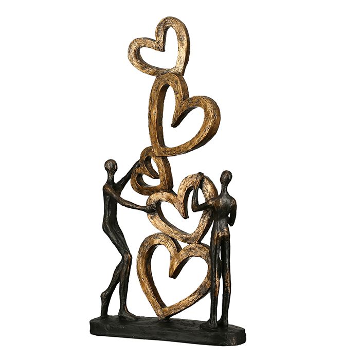 Skulptur Herz auf Herz goldfarbene Herzpyramide schwarzer Basis mit Spruchanhänger