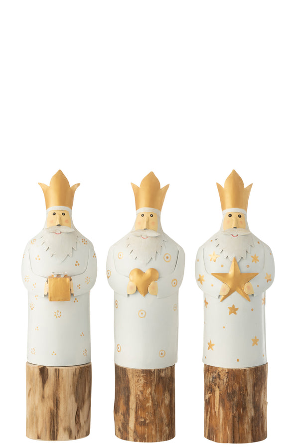 Three holy kings made of metal, hand-painted white/gold, on a wooden trunk