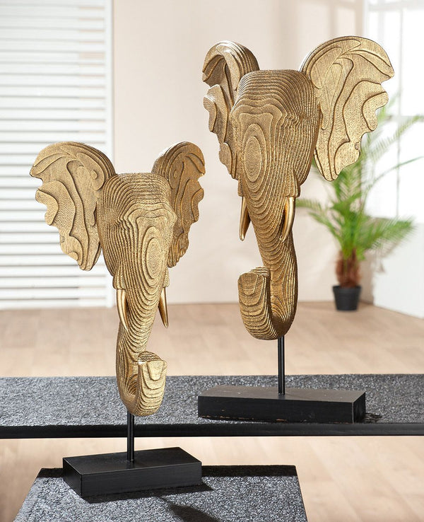 Gold-coloured elephant sculpture made of synthetic resin on a black base