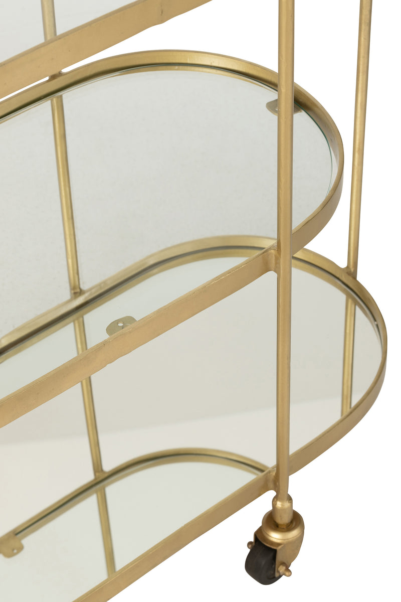 Elegant oval metal service trolley in mirror gold