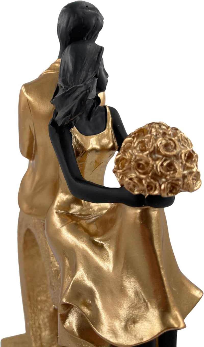 Elegant sculptuur van een zittend echtpaar in de vorm van een hart, zwart en goud
