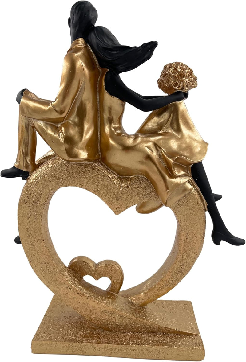Elegant sculptuur van een zittend echtpaar in de vorm van een hart, zwart en goud
