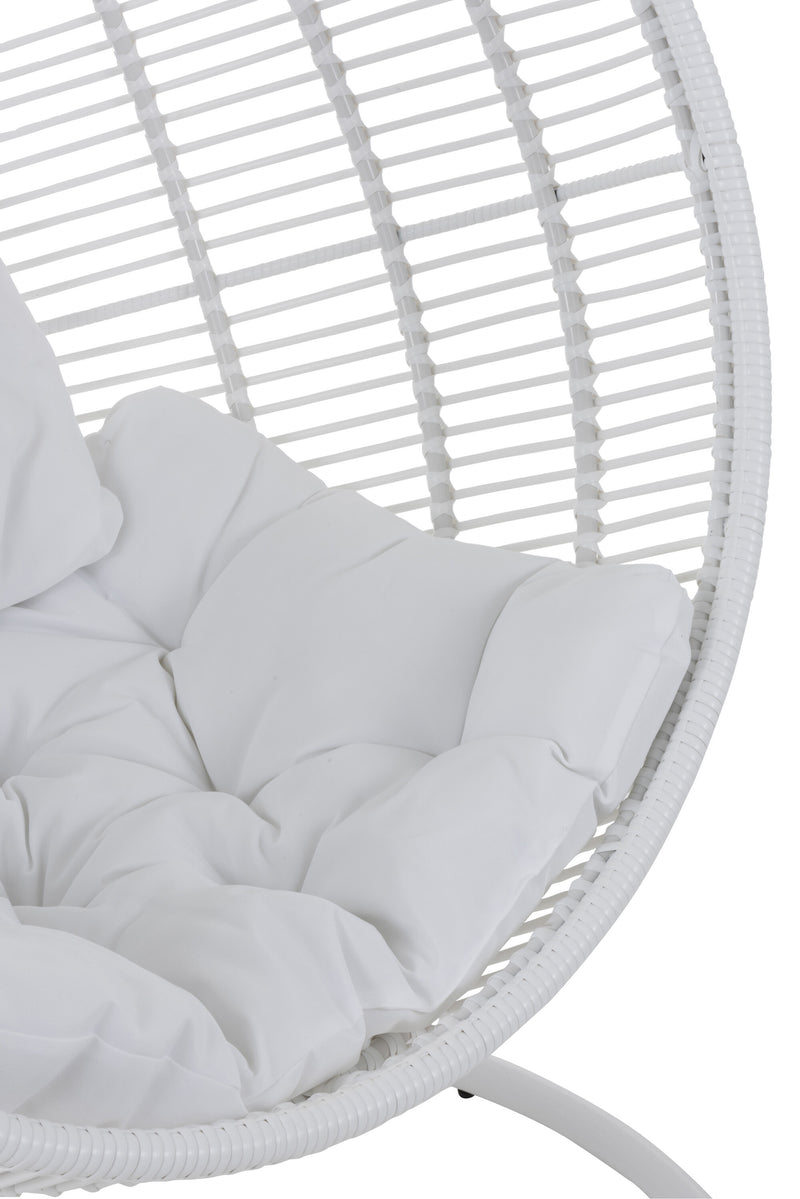 Round hammock chair made of steel and wicker in white: relaxation and coziness outdoors