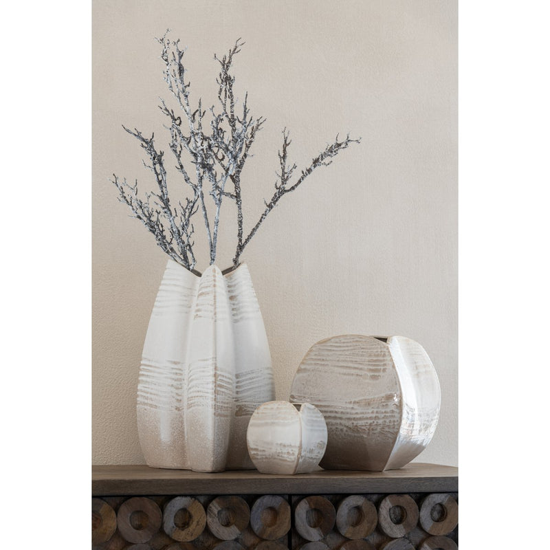 Abstract tripod vase made of clay in beige