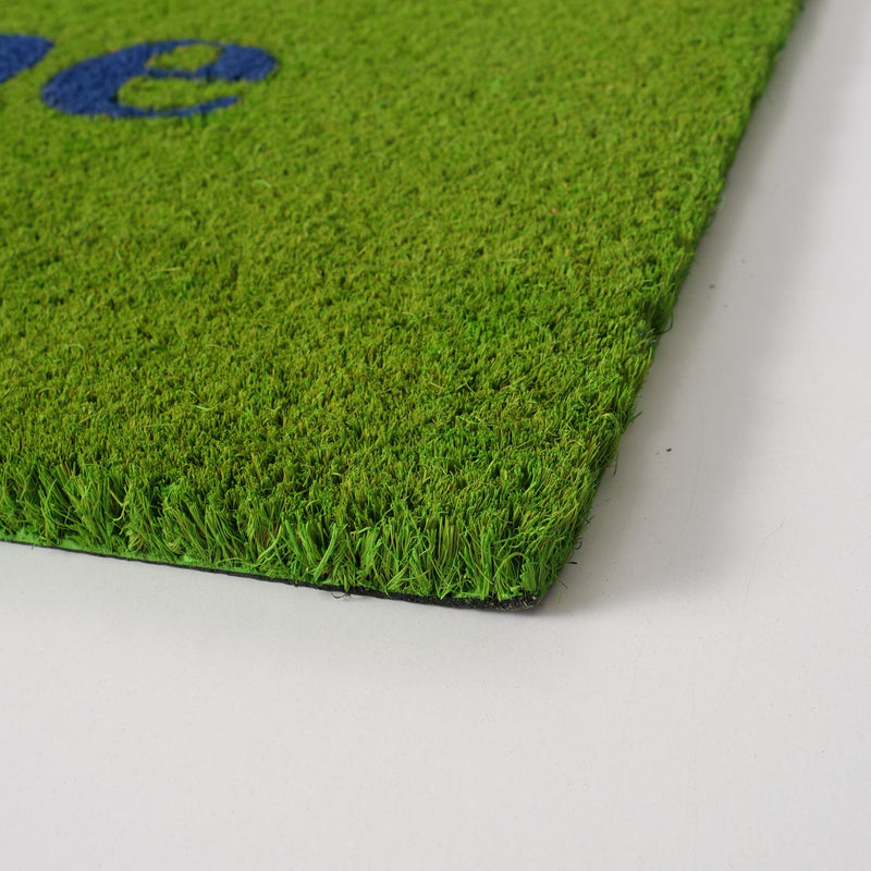 Home doormat in grass green with blue lettering – decorative and robust for the entrance area