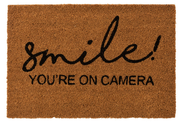 Smile for the camera De originele deurmat van kokosnoot met een boodschap