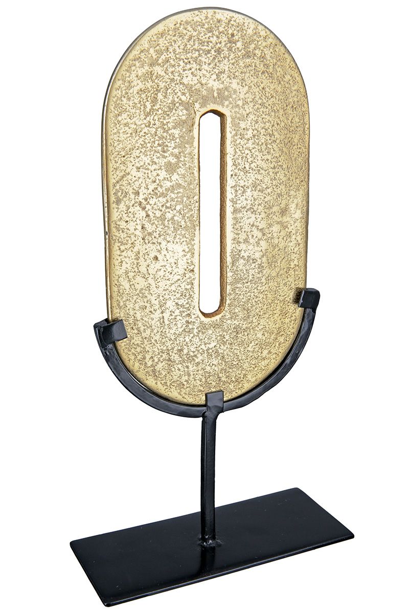 Zero Gold-colored, round object on a black metal stand
