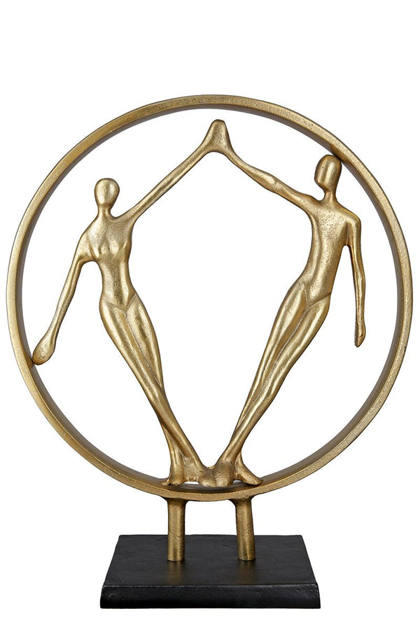 Hand in Hand - A gold colored decorative sculpture on a black metal base