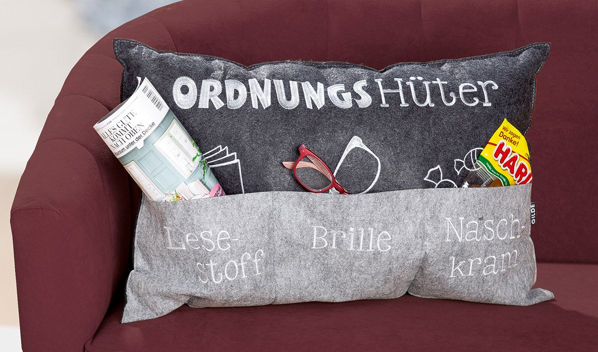 Pillow order guard light grey/dark gray with pockets, embroidered "Lesstoff" / "Glasses" / "Naschkram"